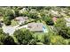 Single-story home in a cul-de-sac has a large backyard with a private pool and patio area at 7495 Birdland Cres, Spring Hill, FL 34607
