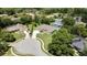 Single-story home in a peaceful cul-de-sac features a manicured lawn and mature trees at 7495 Birdland Cres, Spring Hill, FL 34607