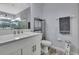 This bathroom features a glass shower, modern vanity, and neutral wall color at 7495 Birdland Cres, Spring Hill, FL 34607