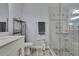 This bathroom features a glass shower, modern vanity, and neutral wall color at 7495 Birdland Cres, Spring Hill, FL 34607