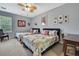 Comfortable bedroom with two twin beds, ceiling fan, neutral walls and carpet at 7495 Birdland Cres, Spring Hill, FL 34607