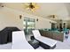 Enjoy the outside with lounge chairs, a ceiling fan, and plenty of space to relax and enjoy the weather at 7495 Birdland Cres, Spring Hill, FL 34607