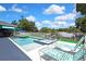 Enjoy the Florida sun in this beautiful pool with a spa and plenty of lounge chairs for relaxation at 7495 Birdland Cres, Spring Hill, FL 34607