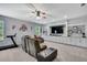 Spacious recreation room with a large built-in media center and comfortable seating at 7495 Birdland Cres, Spring Hill, FL 34607