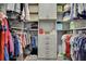 Spacious walk-in closet with custom shelving and organization system at 7495 Birdland Cres, Spring Hill, FL 34607