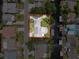 Aerial view showing property lines, the home, and its surroundings from a bird's eye view at 75 N Canal Dr, Palm Harbor, FL 34684
