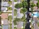 Aerial view of waterfront homes with canals, docks, and lush greenery in a desirable neighborhood at 75 N Canal Dr, Palm Harbor, FL 34684
