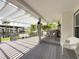 Inviting outdoor space with pergola, grill, and views of the waterfront at 75 N Canal Dr, Palm Harbor, FL 34684