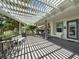 Backyard with pergola, grill, and seating, ideal for outdoor relaxation and gatherings at 75 N Canal Dr, Palm Harbor, FL 34684