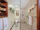 Well-lit bathroom featuring a glass shower and tiled walls, offering a clean aesthetic at 75 N Canal Dr, Palm Harbor, FL 34684