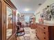 Bedroom featuring charming wood furniture, floral carpet, and a gallery wall with Gathering photos at 75 N Canal Dr, Palm Harbor, FL 34684