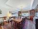 Elegant dining room with hardwood floors, a large table, and plenty of natural light at 75 N Canal Dr, Palm Harbor, FL 34684