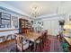 Spacious dining room with chandelier, adjacent to living area, lots of artwork at 75 N Canal Dr, Palm Harbor, FL 34684