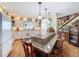 Charming kitchen featuring a granite island, wooden floors, and custom cabinetry at 75 N Canal Dr, Palm Harbor, FL 34684