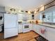 Well-lit kitchen featuring stainless steel appliances and a window over the sink at 75 N Canal Dr, Palm Harbor, FL 34684