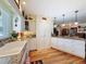 Bright kitchen with hardwood floors, granite countertops, and white cabinets at 75 N Canal Dr, Palm Harbor, FL 34684