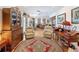 Inviting living room featuring hardwood floors, arm chairs, and a large decorative rug at 75 N Canal Dr, Palm Harbor, FL 34684