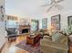 Cozy living room with a brick fireplace and comfortable seating at 75 N Canal Dr, Palm Harbor, FL 34684