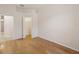 Bedroom featuring hardwood floors, baseboard trim, and closet at 7616 Wimpole Dr, New Port Richey, FL 34655