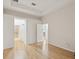 Spacious bedroom featuring hardwood floors and open doorways at 7616 Wimpole Dr, New Port Richey, FL 34655