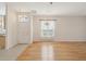 Open living room space with hardwood floors and lots of natural light at 7616 Wimpole Dr, New Port Richey, FL 34655