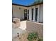 Inviting home entrance featuring a tiled walkway and charming brick accents at 7715 Gulf Highlands Dr, Port Richey, FL 34668