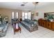 Cozy living room with tile floors and plenty of space for entertaining at 7715 Gulf Highlands Dr, Port Richey, FL 34668