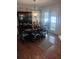 Traditional dining room featuring a dark wood table, chairs, and hutch with natural light at 8008 La Serena Dr, Tampa, FL 33614