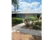 Charming single-story home featuring a landscaped front yard with lush greenery and a well-maintained walkway at 8008 La Serena Dr, Tampa, FL 33614