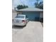 Exterior of a two-car garage and a silver car parked in the driveway at 8008 La Serena Dr, Tampa, FL 33614