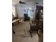 Comfortable living room with carpet flooring, ceiling fan, and a rocking chair at 8008 La Serena Dr, Tampa, FL 33614