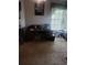Office space featuring a large desk, carpet, and natural light from the window at 8008 La Serena Dr, Tampa, FL 33614