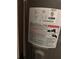 Close up view of the warning label on an electric water heater at 8008 La Serena Dr, Tampa, FL 33614