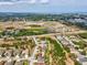 Aerial view of home in community with proximity to green spaces, shopping, and other amenities at 8137 Morning View Dr, Hudson, FL 34667