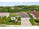 Attractive single-Gathering home featuring mature trees, landscaping, and a three-car garage at 8137 Morning View Dr, Hudson, FL 34667