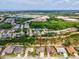 Aerial view of a residential neighborhood showcasing the home and surrounding community with nearby green spaces at 8137 Morning View Dr, Hudson, FL 34667
