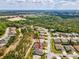 Aerial view of home and surrounding community and green spaces, showcasing the layout of the neighborhood at 8137 Morning View Dr, Hudson, FL 34667