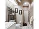 Cozy bathroom showcasing a single sink vanity, an arched doorway, and neutral color scheme at 8137 Morning View Dr, Hudson, FL 34667