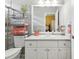 Bright bathroom featuring a glass enclosed shower, gray countertops, and decor at 8137 Morning View Dr, Hudson, FL 34667
