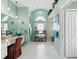 Spa-like bathroom with elegant fixtures, a walk-in shower, and a calming color palette at 8137 Morning View Dr, Hudson, FL 34667