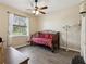 Bright bedroom features a window with natural light, stylish daybed, and modern decor at 8137 Morning View Dr, Hudson, FL 34667