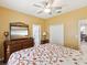 Bright bedroom featuring wooden furniture, closet space, and an open view into the bathroom at 8137 Morning View Dr, Hudson, FL 34667