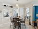 Cozy breakfast nook with natural light, a decorative chandelier, and a view of the outdoors at 8137 Morning View Dr, Hudson, FL 34667