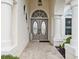 Elegant front entrance featuring double doors, decorative accents, and a welcoming tiled walkway at 8137 Morning View Dr, Hudson, FL 34667