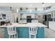 Modern kitchen featuring a center island with bar seating and stainless steel appliances at 8137 Morning View Dr, Hudson, FL 34667