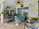 Covered lanai offering a cozy seating area, outdoor kitchen and views of the outdoors at 8137 Morning View Dr, Hudson, FL 34667
