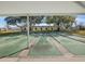 Community shuffleboard courts under a pavilion offer residents a place to relax and socialize at 8137 Morning View Dr, Hudson, FL 34667