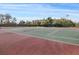 Community tennis court with a net is an excellent spot for residents to enjoy the outdoors at 8137 Morning View Dr, Hudson, FL 34667