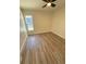 Bedroom with luxury vinyl flooring and ceiling fan at 8413 Monarch Dr, Port Richey, FL 34668