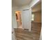 Hallway view featuring a bathroom and bedroom showcasing the layout of the home at 8413 Monarch Dr, Port Richey, FL 34668